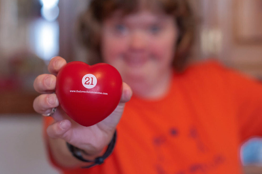 Julie holding a 21 Chromosome heart