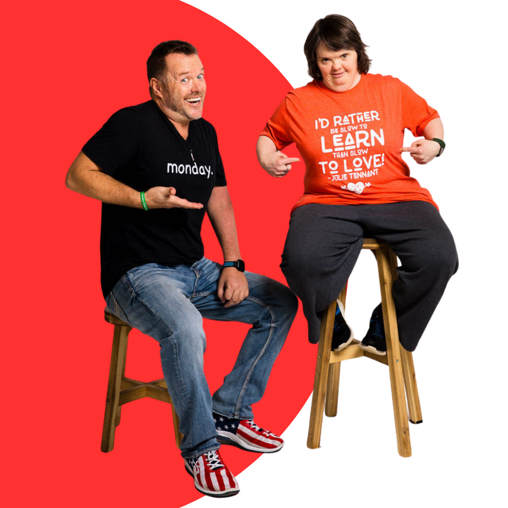Derrick and Julie on chairs in Julie's new shirts.